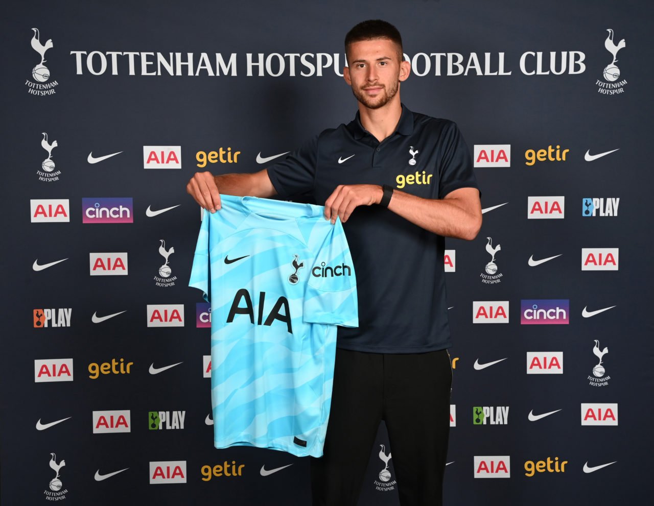Guglielmo Vicario poses as he signs for Tottenham Hotspur