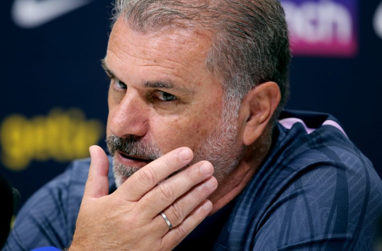 Ange Postecoglou touches his face